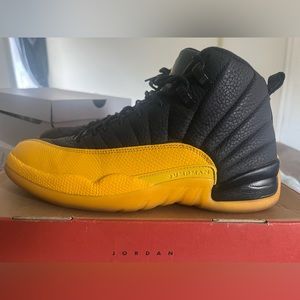Black and yellow Jordan 12s men’s size 9.5